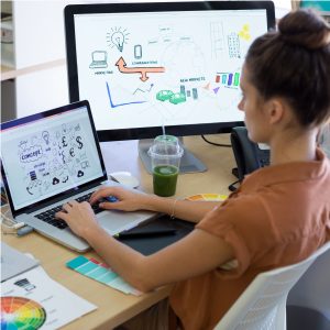 Female executive working over laptop at her desk