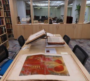 Historical books open on a table