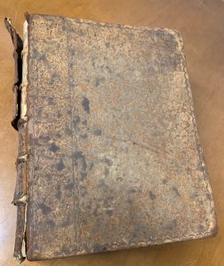 Book with falling apart leather cover