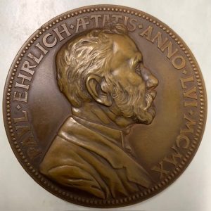 A bronze medallion with the profile of Erlich