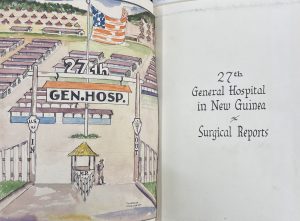 A book lying open. The left page features a watercolor painting of a gate followed by buildings. The right page is the title page. Text reads "27th General Hospital in New Guinea - Surgical Reports."